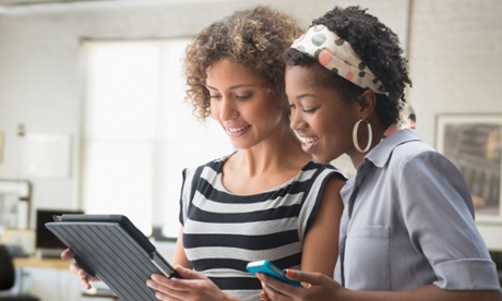 Women using mobile and tablet devices 