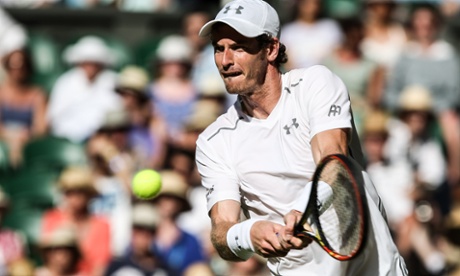 Andy Murray returns the ball to Mikhail Kukushkin during the men's singles match at the 2015 Wimbledon Championships.