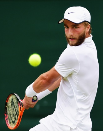 Liam Broady gets ready to fire a backhand return to David Goffin.