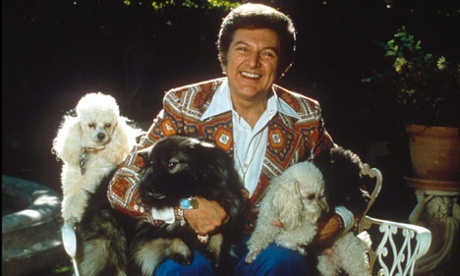 Liberace with his dogs.
