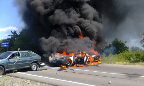 A burning police car in Mukacheve on Saturday.