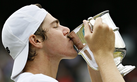 Reilly Opelka of the United States celebrates after winning the boys’ singles final