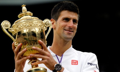 Novak Djokovic poses with the Wimbledon trophy after defeating Roger Federer to claim his ninth grand slam title.