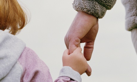 man holding a girl's hand.