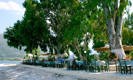 Taverna tables at Karavomilos lake, Kefalonia, Greece.