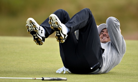 Jordan Spieth falls over laughing in reaction to a putt during a practice round at St Andrews