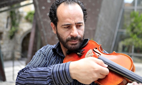 Ramzi Aburedwan playing the viola at his music school in Ramallah