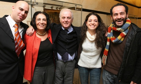 Music without borders: Israeli conductor Daniel Barenboim (centre) and Ramzi Aburedwan (right) with members of the Divan orchestra.