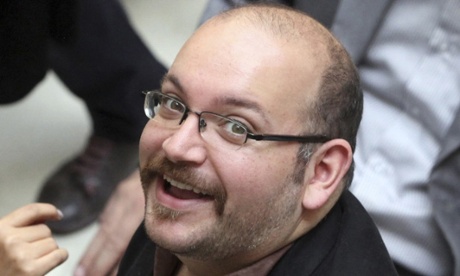 Jason Rezaian, an Iranian-American correspondent for The Washington Post, smiles as he attends a presidential campaign of President Hassan Rouhani in Tehran in 2013.