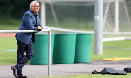 Claudio and some bins watch Leicester's players in training.
