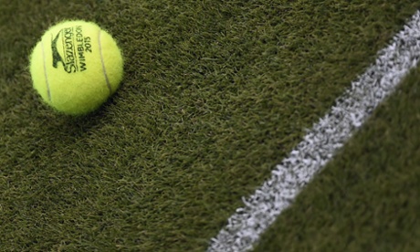 A tennis ball is seen on court during a practice session at Wimbledon
