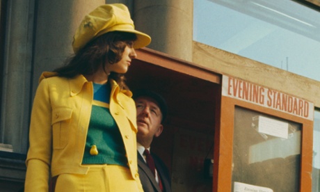 A model wearing a yellow trouser suit, circa 1975.