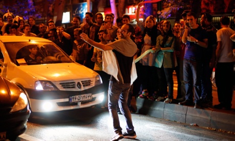 Iranians celebrate in the street of Tehran after nuclear talks between Iran and world powers ended in Vienna, Austria.