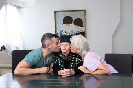 Jacob Kenedy with his Grandmother Ginny, and his Mother, Haidee, in front of one of Ginny’s paintings.