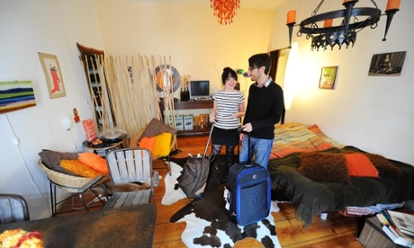 Home sweet home: a couple arrive in their Airbnb apartment.