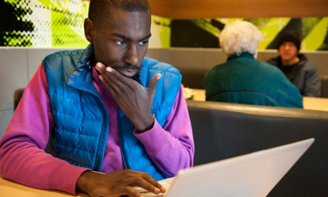 Activist DeRay Mckesson updates his website and posts updates to Twitter from a McDonald's in Ferguson.