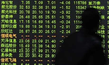 A Chinese investor looks at falling share prices at a brokerage house in Hangzhou city in east China on 7 July.