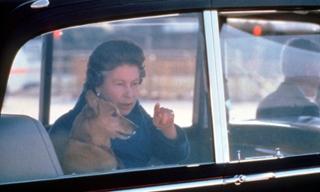 The Queen with a corgi at Heathrow aiport in 1986