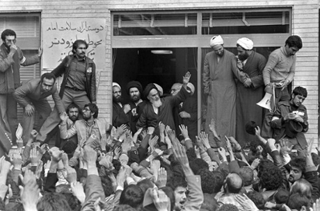 Ayatollah Khomeini, center, waves to followers as he appears at the window of his headquarters in Tehran, Iran on 2 February 1979, the second day of his return from exile.