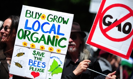 Protesters hold up placards against Monsanto and the use of glyphosate in the US.