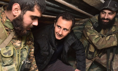 President Bashar al-Assad talks to soldiers during a visit to Jobar