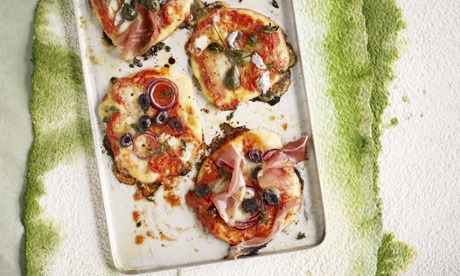 Pizzas with tomato sauce and various toppings