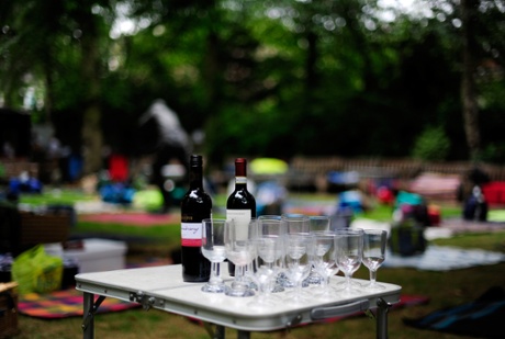 A table with wine is set up in the Coronation Garden ready for the lunch interval.