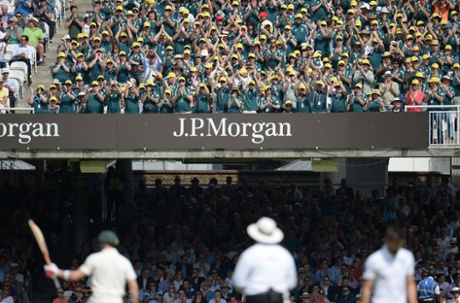 Australian fans applaud as Steve Smith, left, reaches his half century.