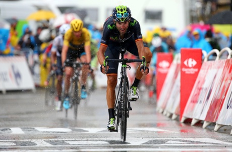 Movistar Team's Alejandro Valverde crosses the finish line ahead of Chris Froome.