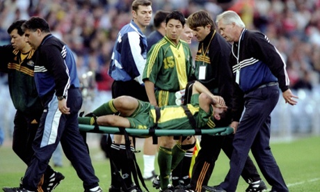 Simon Colosimo is taken off in extreme pain after being tackled by Andy Cole during the friendly against Manchester United.