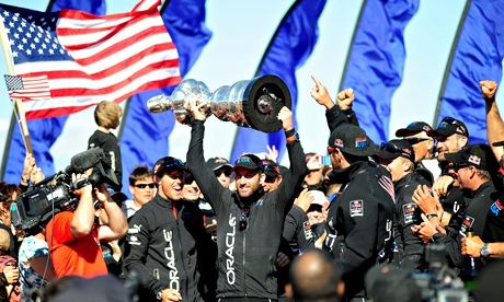 Sir Ben Ainslie holding up the America's Cup trophy in San Francisco in September 2013