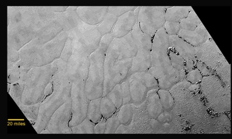 A new close-up image from the heart-shaped feature on the surface of Pluto that reveals a vast, craterless plain. 