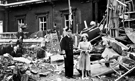 King George VI and Queen Elizabeth stand amid the bomb damage at Buckingham Palace. 