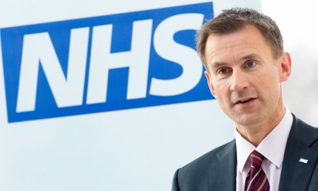 Health secretary Jeremy Hunt next to NHS logo