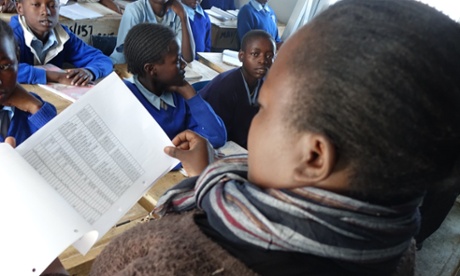 Gladys Achieng takes the register at the start of a school day.