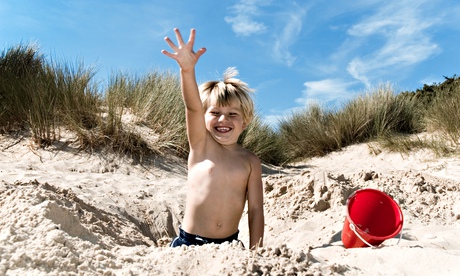 A boy playing on a beach