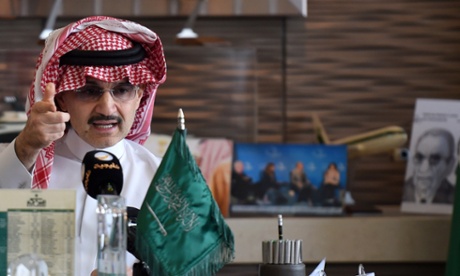 Saudi Arabia's billionaire Prince Alwaleed bin Talal gestures during a press conference in the Saudi capital, Riyadh, on July 1, 2015. Alwaleed pledged his entire $32-billion (28.8-billion-euro) fortune to charitable projects over the coming years. The prince said in a statement that the 