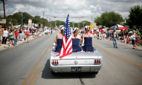 A photo showing parade participants making their way through town during the Independence Day parade July 4, 2008 in Wimberley, Texas