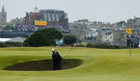 Marc Leishman chips out of the bunker on 16.
