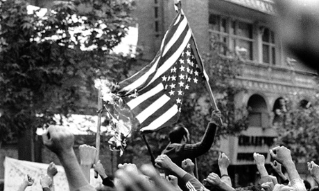 Demonstrators burn US flag outside the US embassy in Tehran.