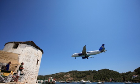 Jet landing at a Greek island. Figures on booking show a drop in recent weeks, compared with a year ago.