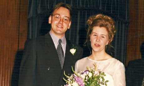 Jez John next to Louisa Scott, holding flowers, on their wedding day