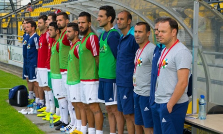 Team AFE players watch with the coaches hoping they will get a chance to come off the bench and show their talents.