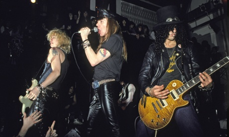 (L-R) Duff McKagan, Axl Rose and Slash of Guns N' Roses perform an acoustic set at The Limelight on January 31, 1988 in New York City