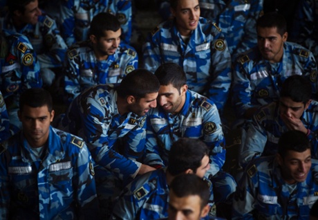 Members of the Iranian air force talk to each other while attending an Eid al-Adha prayer ceremony in Tehran.