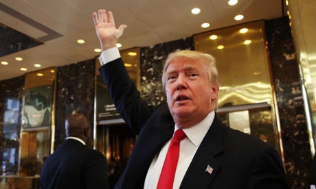 Donald Trump greets supporters, tourists and the curious after taping an interview with Anderson Cooper at a Trump-owned building in New York.