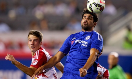 Diego Costa heads the ball as Leo Stolz watches on.