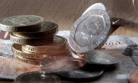 Money falling on desk