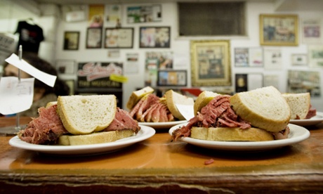 Smoked meat sandwiches sit on the counter at Schwartz's deli in Montreal, Canada