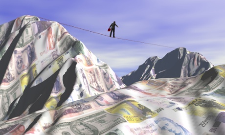 A man walks across a tightrope above a sea of money